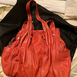 B. Makowsky orange leather purse